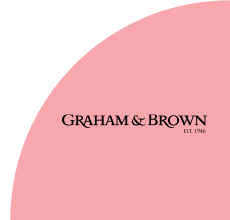 Graham & Brown logo with pink curved background